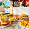2 Hamburguesas Caseras a Elegir + Papas a Compartir + 2 Bebidas en Taller Burger